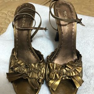 Gold sandals with ankle straps
